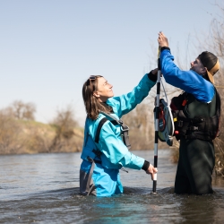 Bray Grad Student performing river Measurements